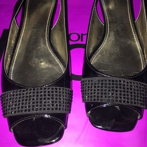 Sling back open toe flats.